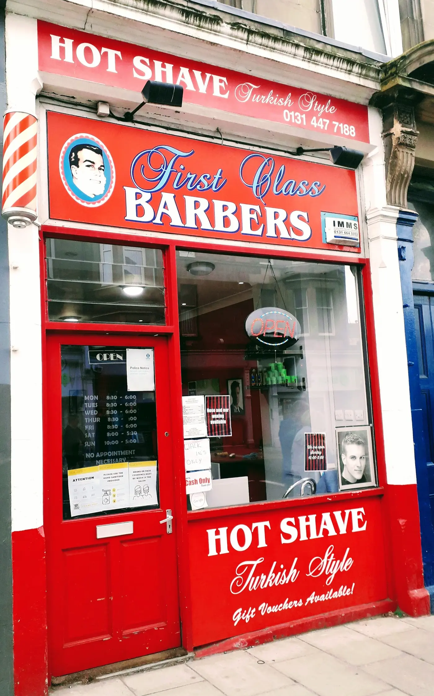 First Class Barbers Hot Shave red shopfront with barber pole, Morningside Road, Edinburgh
